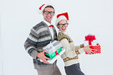 Geeky hipster couple holding presents