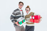 Geeky hipster couple holding presents