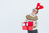 Thoughtful geeky hipster holding presents