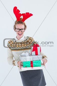 Happy geeky hipster holding presents