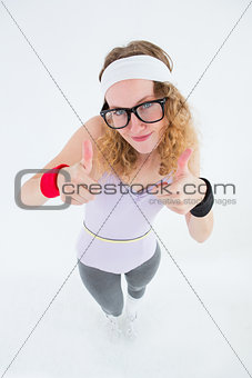 Geeky hipster posing with thumbs up