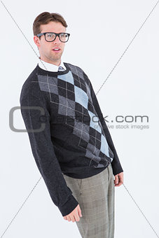 Geeky hipster leaning looking at camera