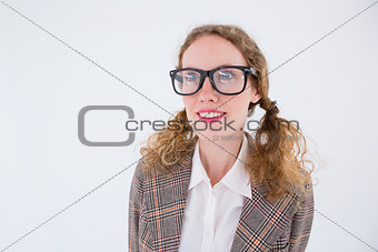 smiling  geeky hipster girl looking at something