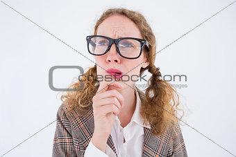 Geeky hipster woman thinking with hand on chin