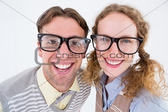 Happy geeky hipster smiling at camera