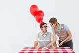 Geeky hipster couple celebrating his birthday