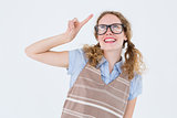 Geeky hipster woman pointing up
