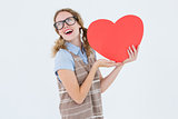 Geeky hipster woman holding heart card