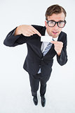 Geeky hipster businessman holding card