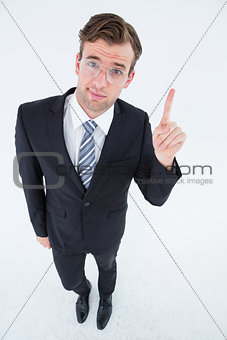 Geeky businessman with finger up