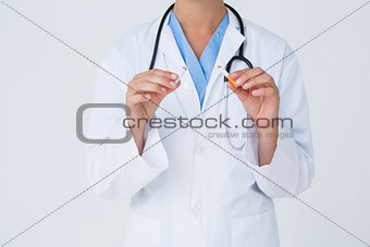 Doctor holding broken cigarette as incentive to quit