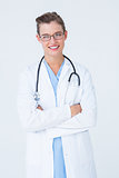 Doctor with arms crossed smiling at camera
