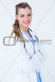 Doctor smiling to camera with arms crossed
