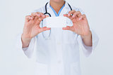 Doctor holding card