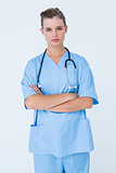 Serious nurse looking at camera with arms crossed