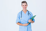 Smiling nurse holding clipboard