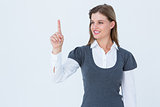 Smiling woman pointing something with her finger