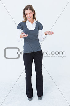 Happy woman holding her smartphone