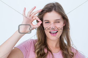 Pretty woman gesturing ok sign