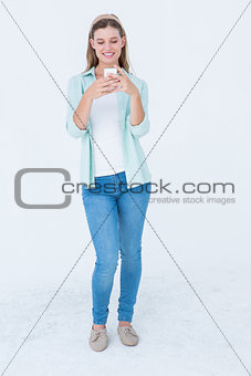 Pretty hipster using her smartphone