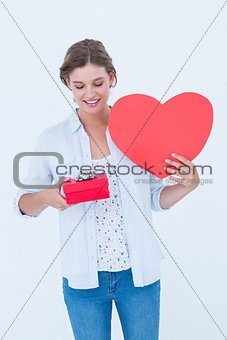Woman holding a present and heart card
