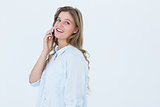 Smiling woman calling with her smartphone