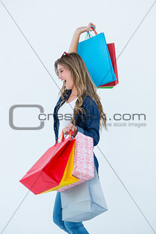 Excited woman holding some shopping bags