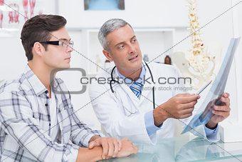Doctor showing Xrays to his patient