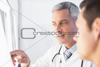 Doctor showing X rays to his patient