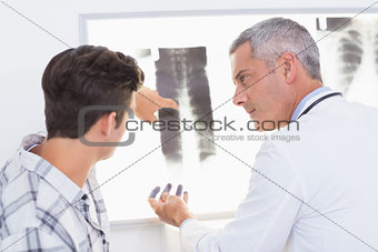 Doctor explaining X rays to his patient