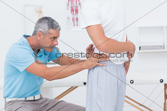 Doctor examining his patient back