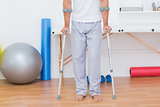 Patient standing with crutch