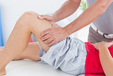 Man having thigh massage