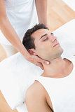 Man receiving neck massage