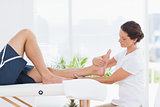 Physiotherapist doing leg massage