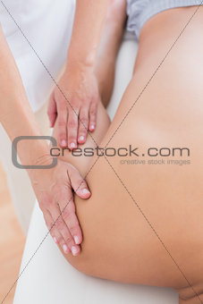 Physiotherapist doing arm massage to her patient
