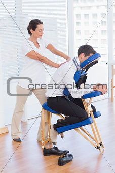 Businessman having back massage
