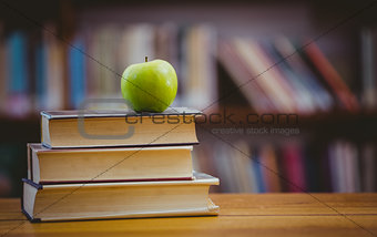 Apple on pile of books