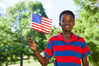 Little boy waving american flag