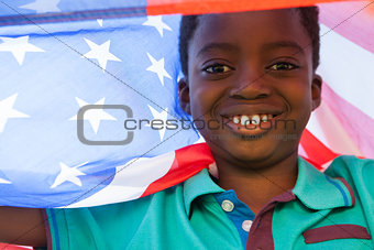 Happy boy in the park with american flag