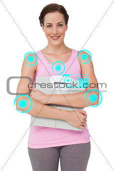 Composite image of portrait of a smiling young woman with weight scale