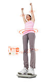 Composite image of young woman cheering on weight scale