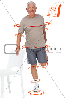 Composite image of full length portrait of a happy senior man stretching leg