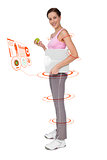 Composite image of young woman with weight scale and apple