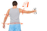 Composite image of rear view of a young man holding out dumbbell