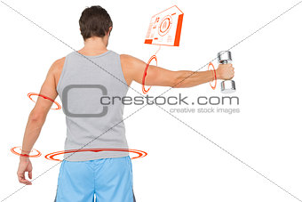 Composite image of rear view of a young man holding out dumbbell