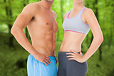 Composite image of mid section of a fit young couple