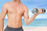 Composite image of fit shirtless man lifting dumbbell