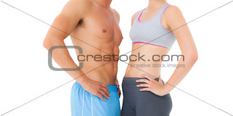 Mid section of a fit young couple