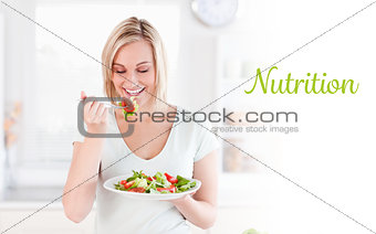 Nutrition against gorgeous woman eating salad